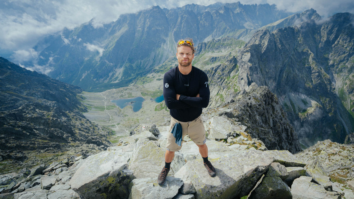 A man standing in the mountains